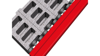Vue détaillée des tampons de compensation à l'intérieur d'un bras de pince à briques